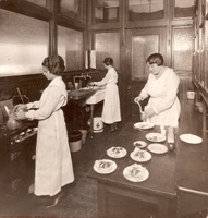 Home economics students cooking in Kitchen B