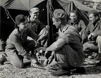 Captain Beatrice Parker '34 posed interviewing soldiers near their tents in Rome, Italy