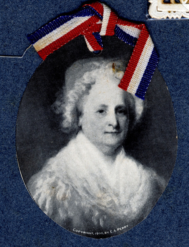 Photo of Martha Washington with a red-white-and-blue bow above