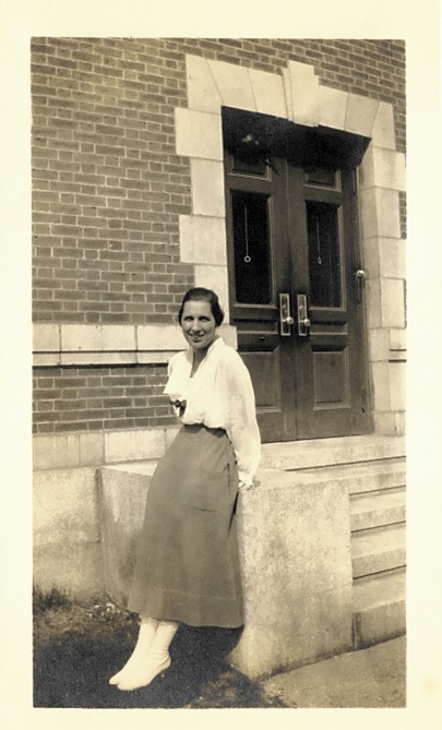 Blanche Castleman posed near North Hall steps 1917